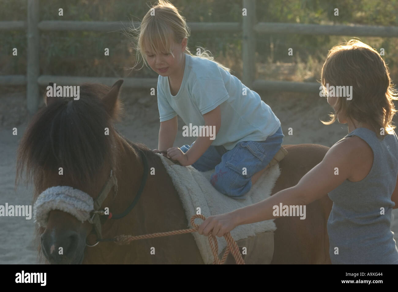 Mother and daughter horse riding Stock Photo Alamy