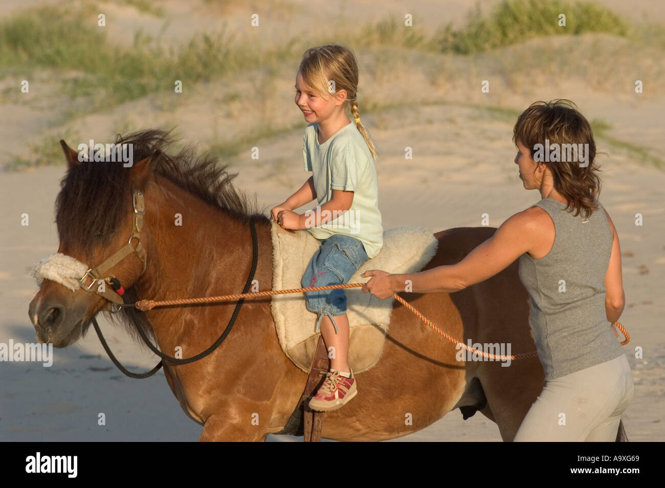 mother and daughter horse riding outdoors Stock Photo Alamy