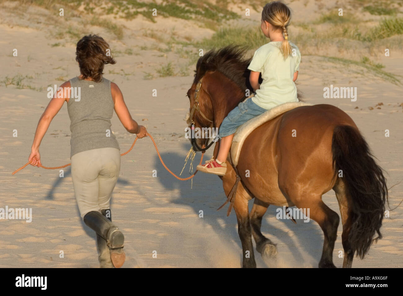 mother and daughter horse riding outdoors Stock Photo Alamy
