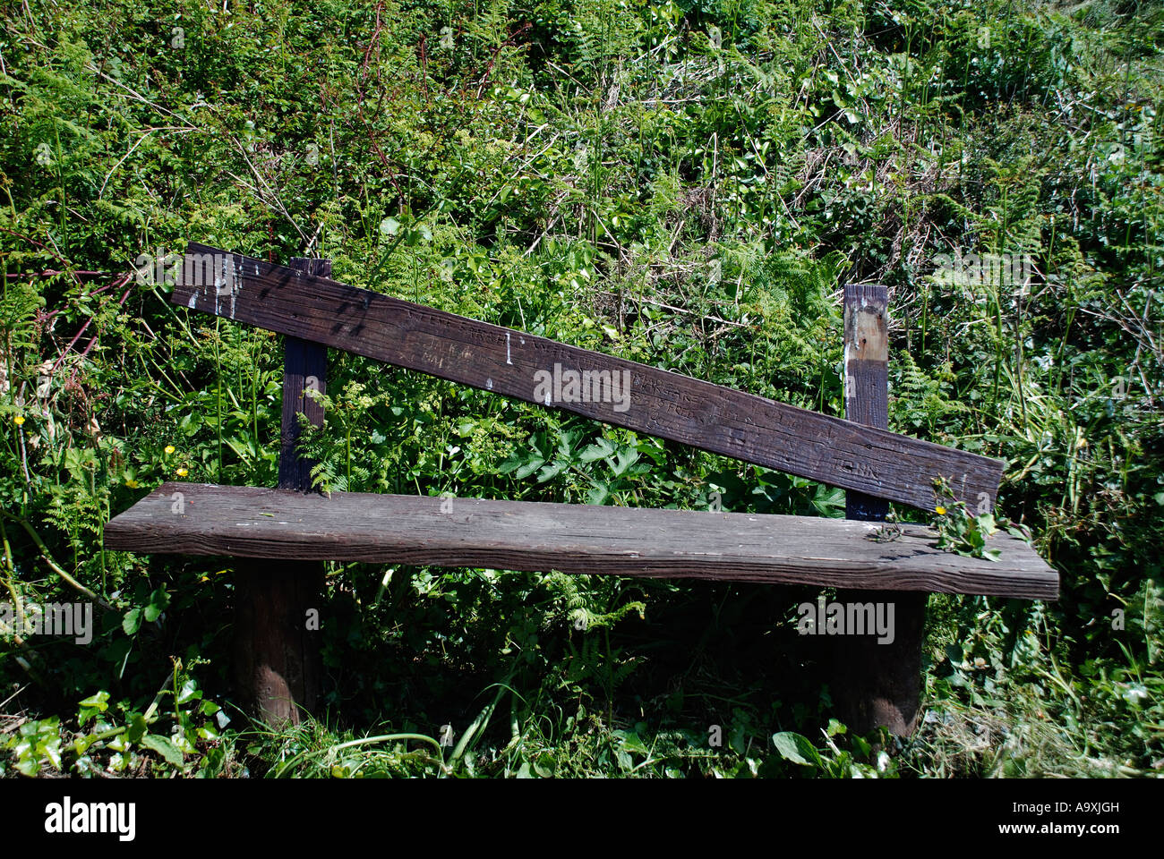 Broken bench on Cornish coast path Stock Photo - Alamy
