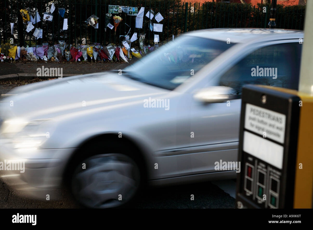 Pedestrian crossing accident site with car rushing by Stock Photo - Alamy