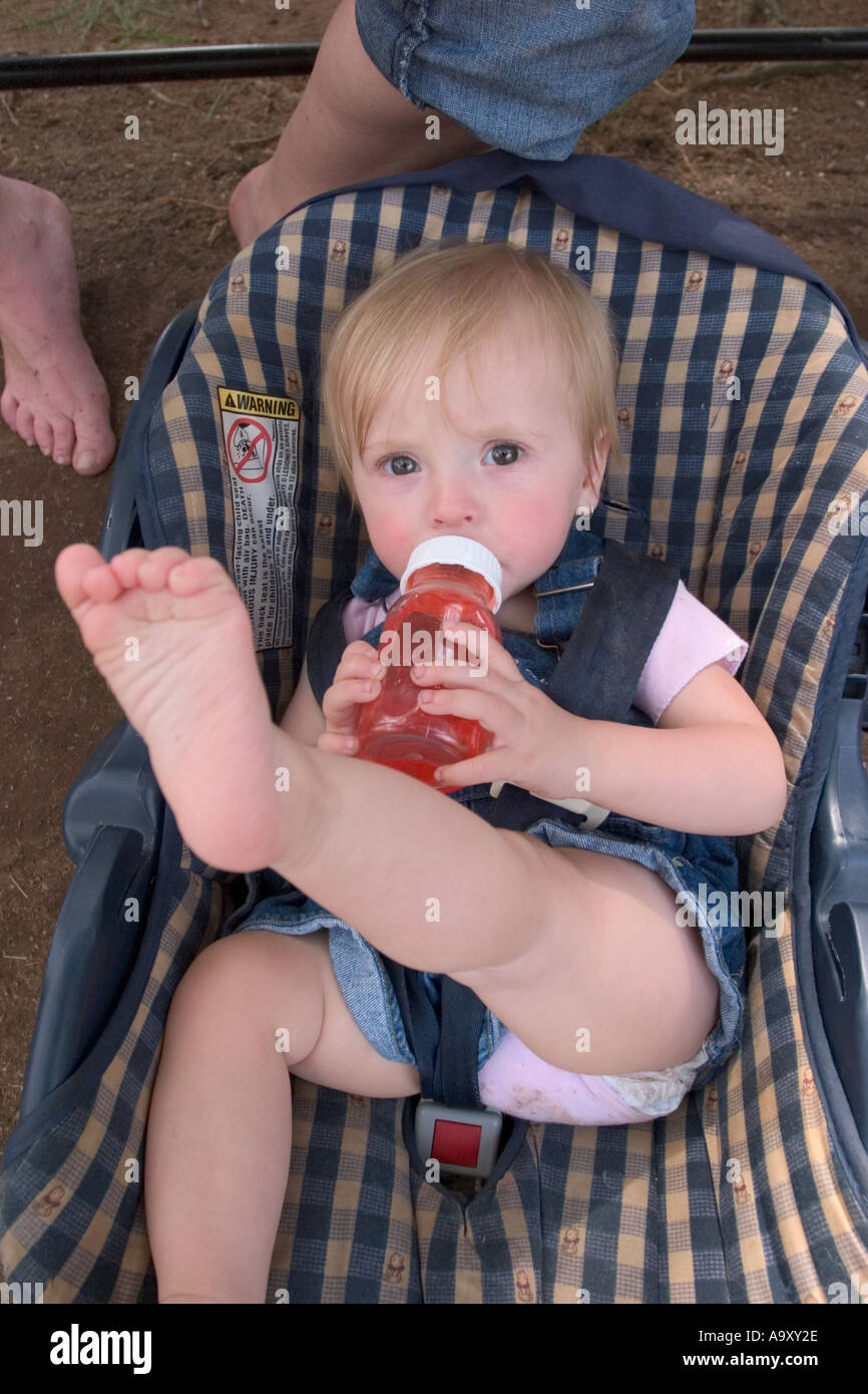 Baby drinking bottle in car sale seat