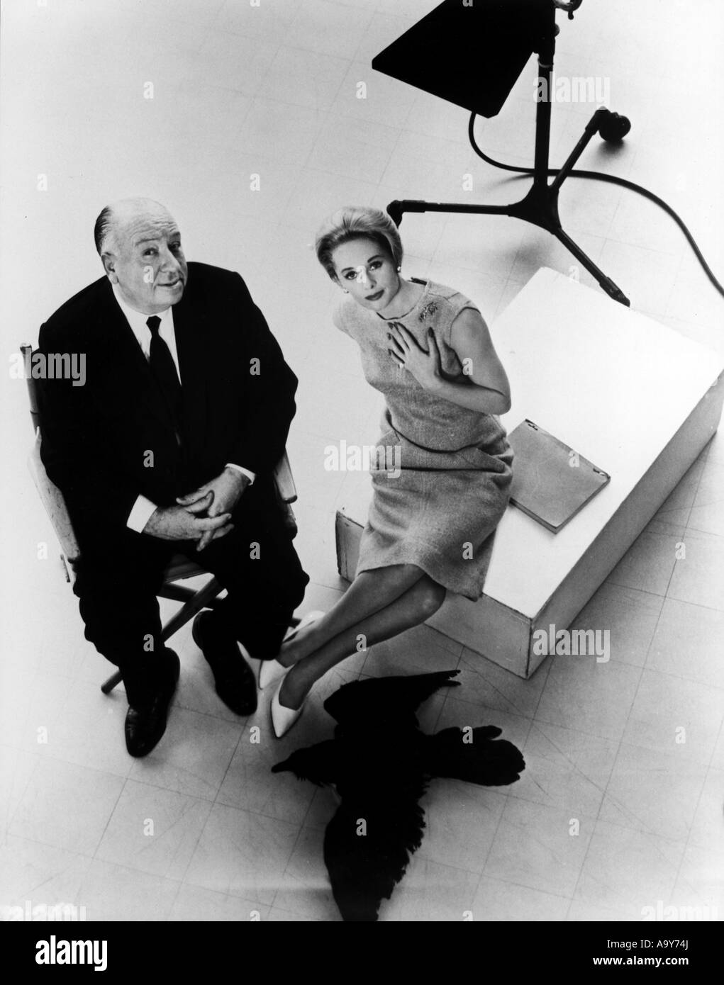 ALFRED HITCHCOCK with Tippe Hedren during filming of The Birds in 1963 Stock Photo