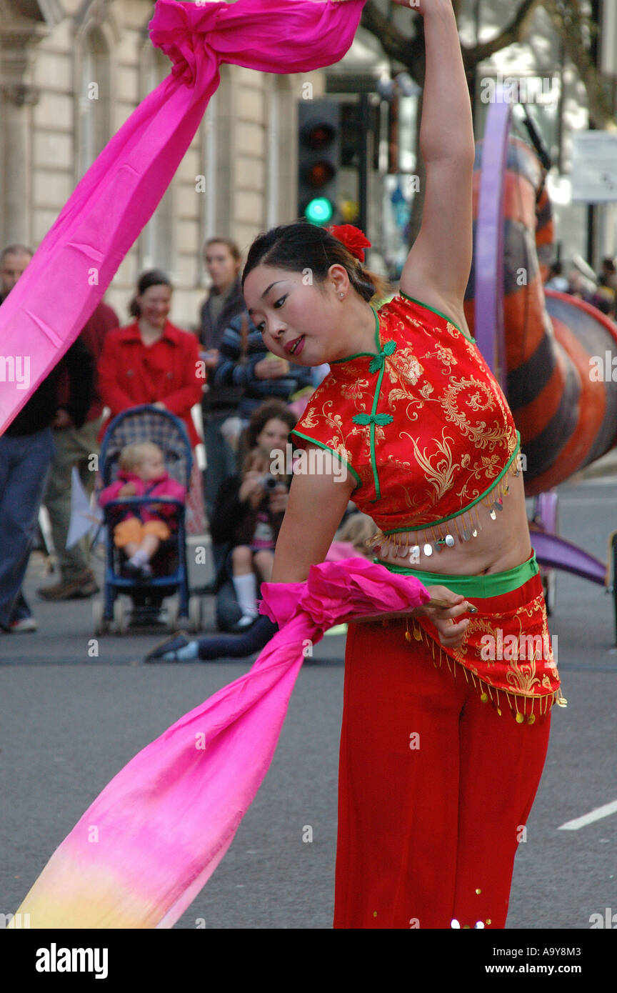 Japanese dancer performing an 'air drawing' with silks at the big draw opening event, London, UK Stock Photo