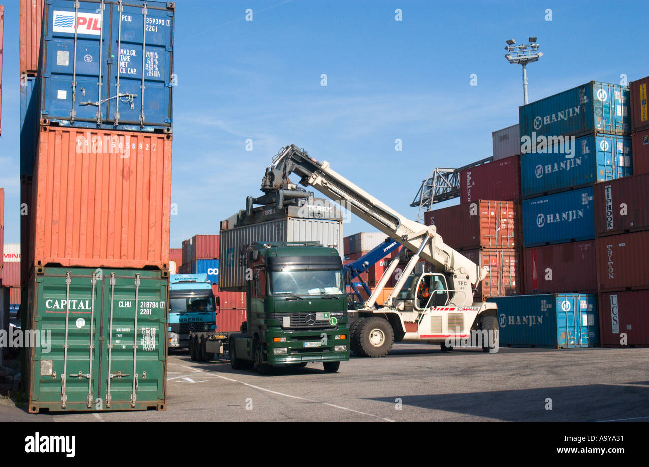 freight container is loaded onto truck in container terminal Stock