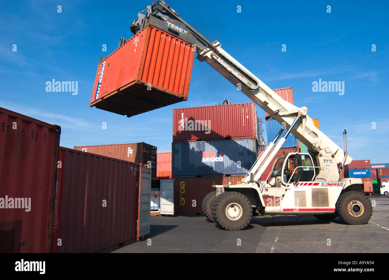 lifter loader moving freight container in container terminal Stock