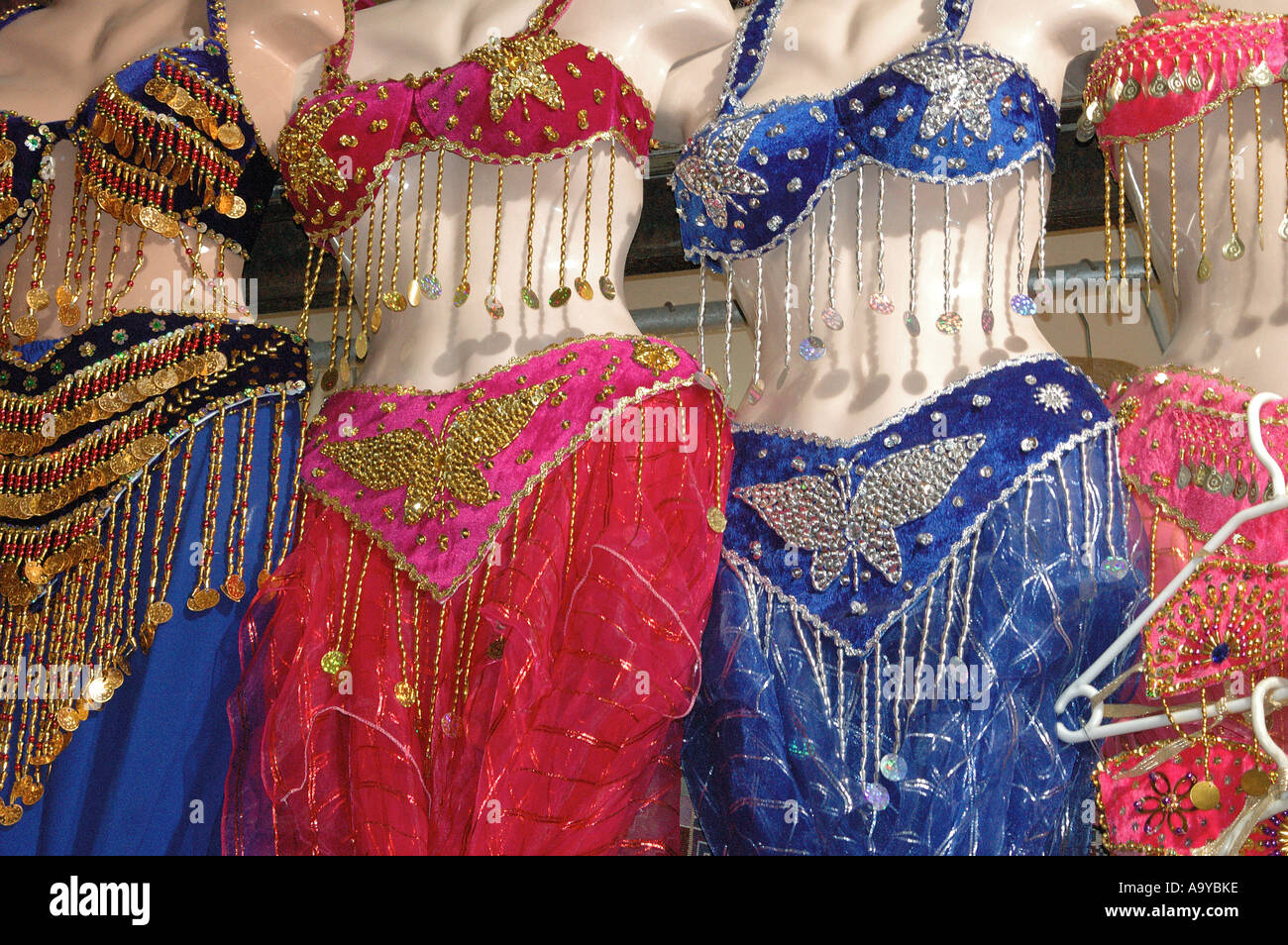 A row of belly dancing outfits for sale 