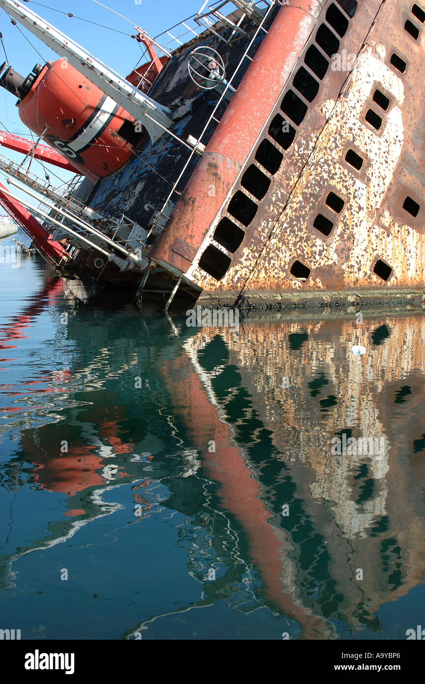A half sunken ship with its reflection. Sultanahmet area, Istanbul, Turkey Stock Photo