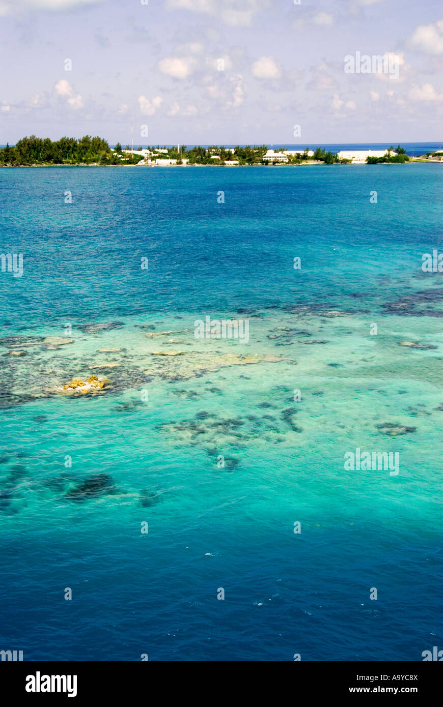 Bermuda shallow coral reef with blue water off Royal Naval Dockyard Stock Photo