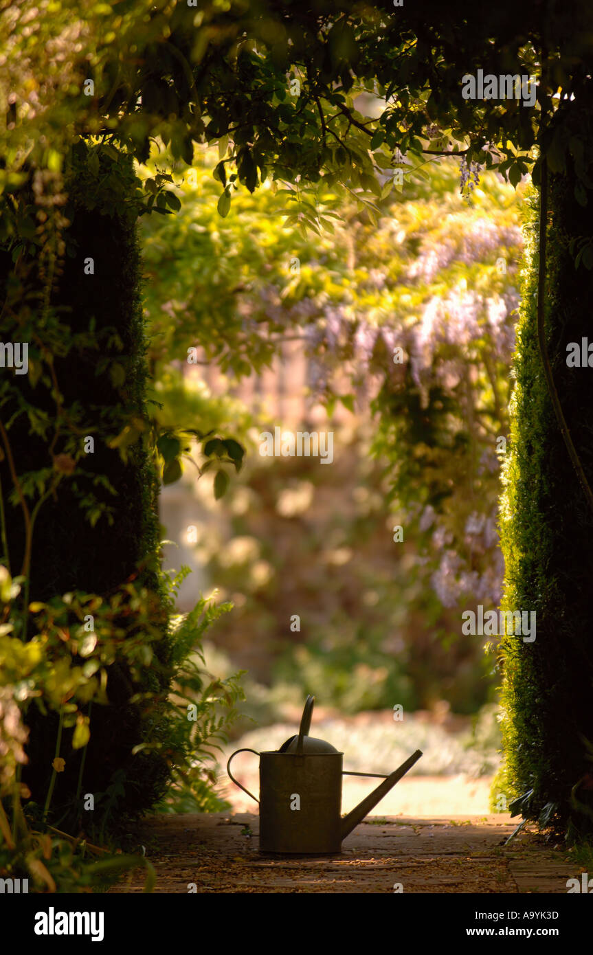 Pound Hill House and Gardens in West Kington Wiltshire UK A watering can May 2005 Stock Photo