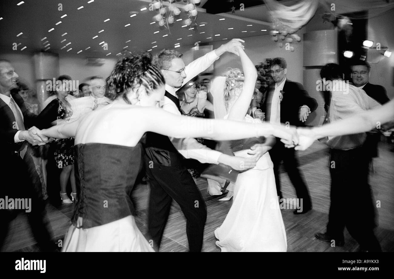 Poland, Lodz, guests dancing at wedding party (B&W) Stock Photo