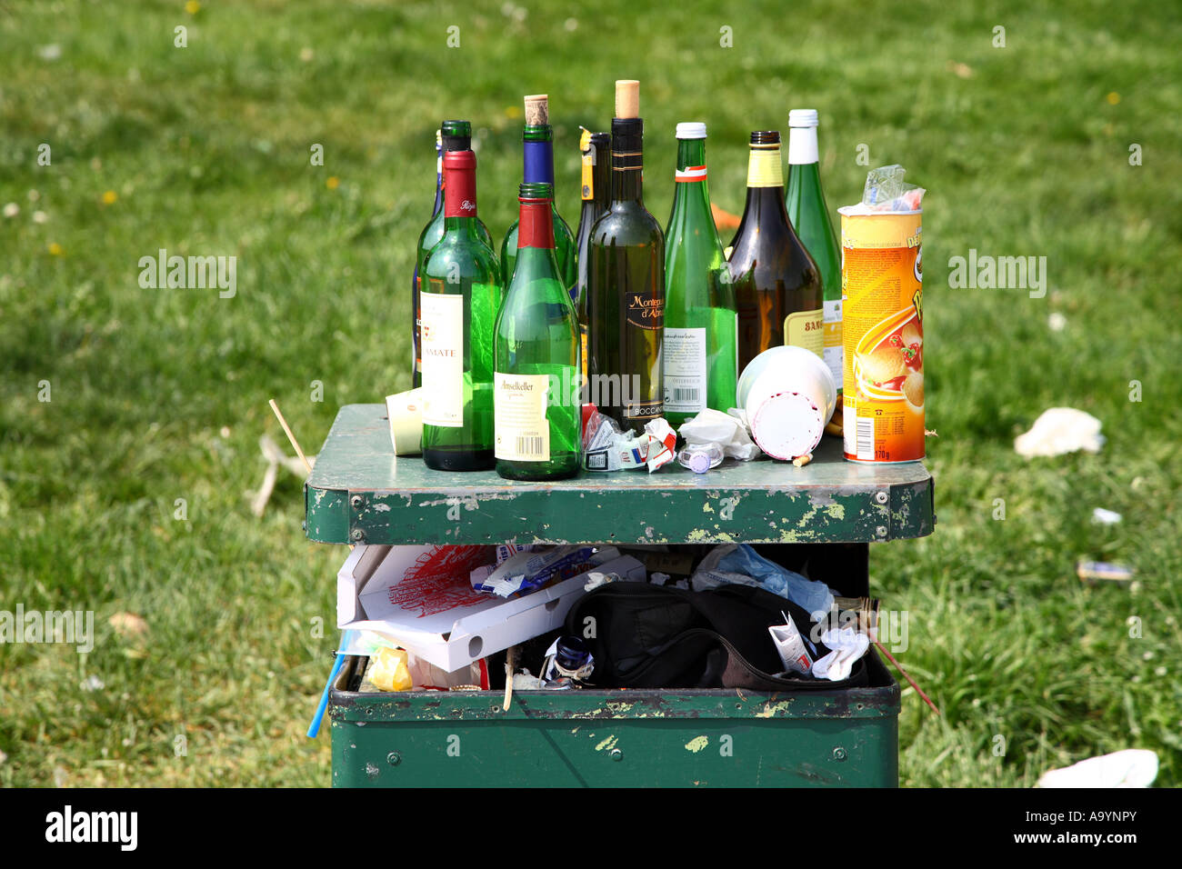 Garbage can full with empty bottles Stock Photo