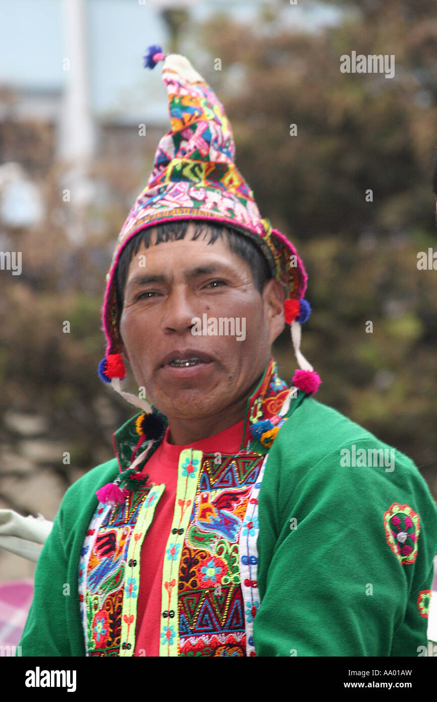 Traditional Bolivian man, peasant, campesino wearing self made colourful clothes in a woollen hat Stock Photo
