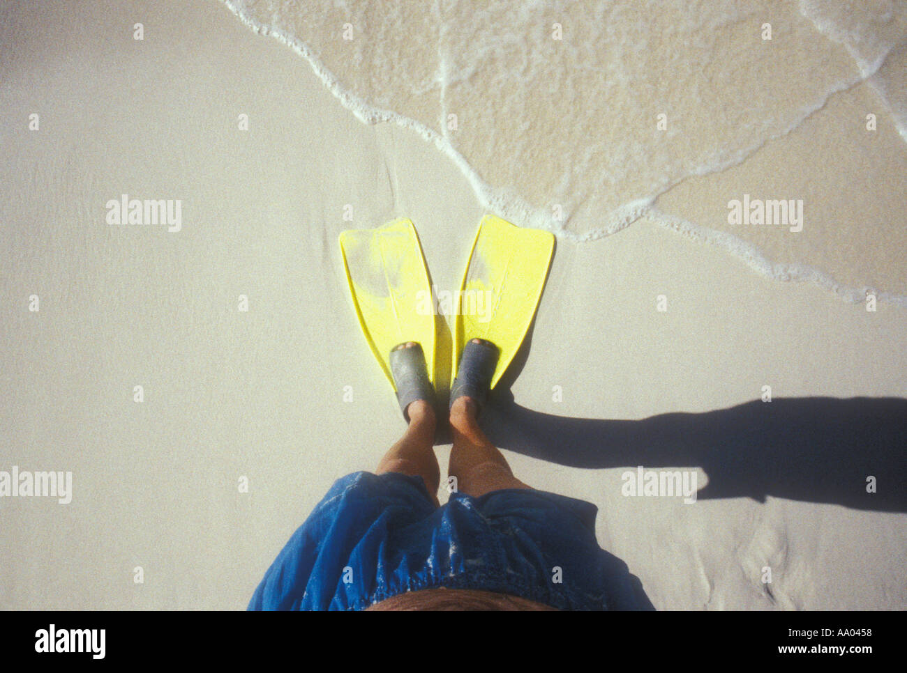 View of mans feet in swim fins on the beach in the Caribbean USVI Stock