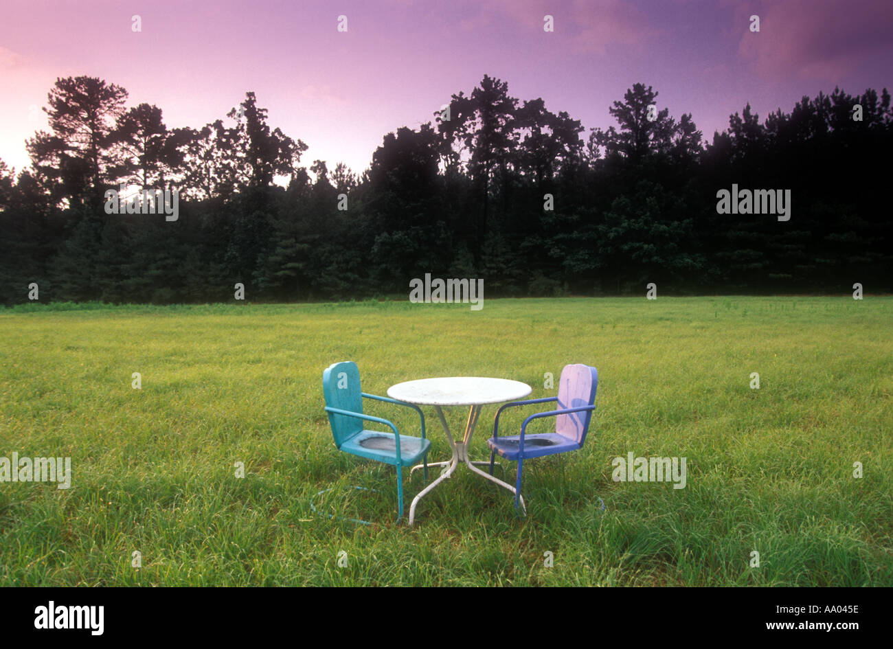 Chairs and table in field property released image Stock Photo