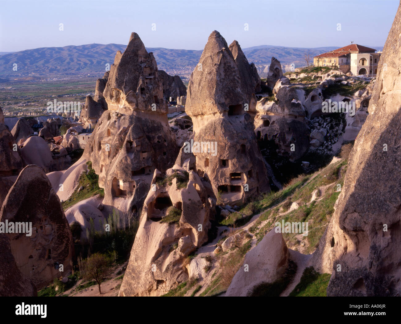 Turkey, Central Anatolia, Nevşehir Province, Uchisar village. Tunneled out homes in the volcanic rock formations Stock Photo