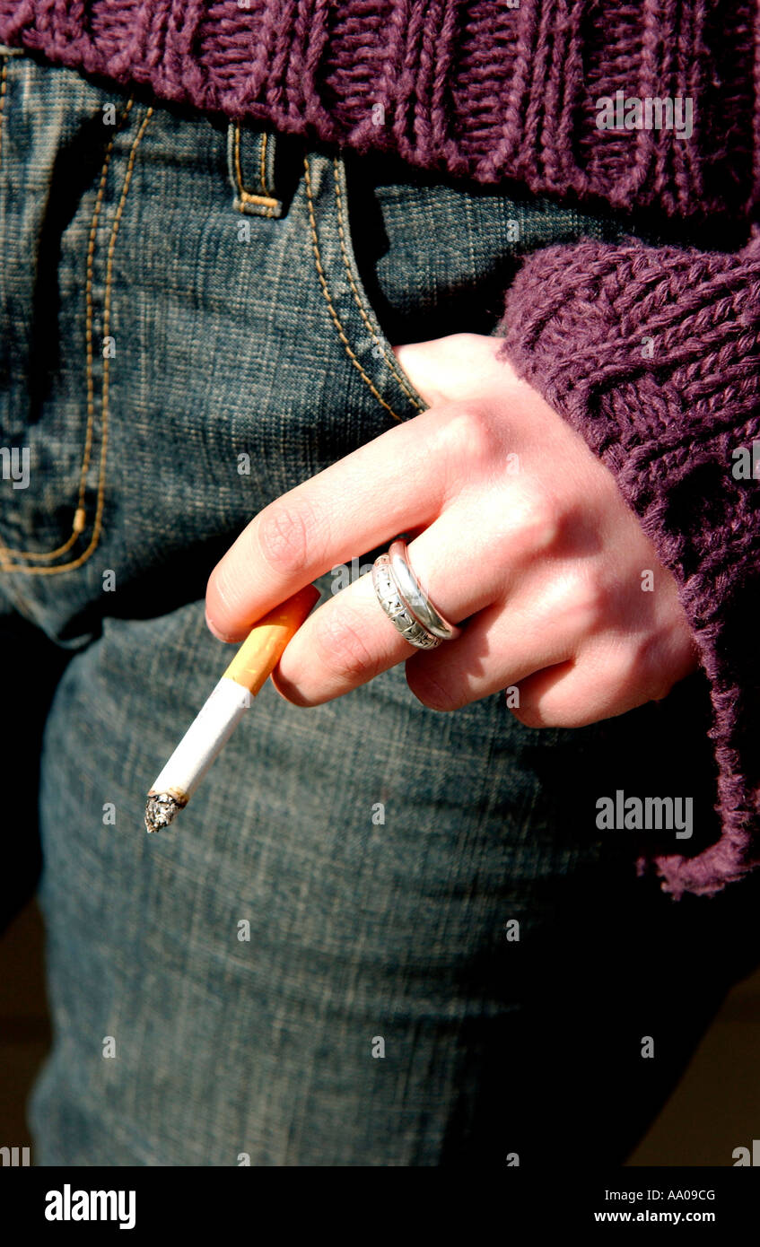 Young woman / teenager smoking Stock Photo