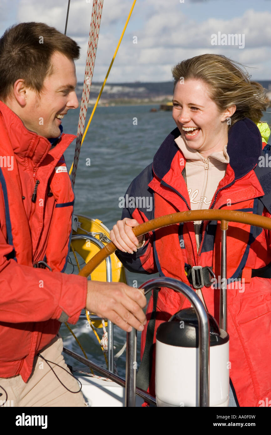 Crew being instructed in the use of the compass and helm Stock Photo ...