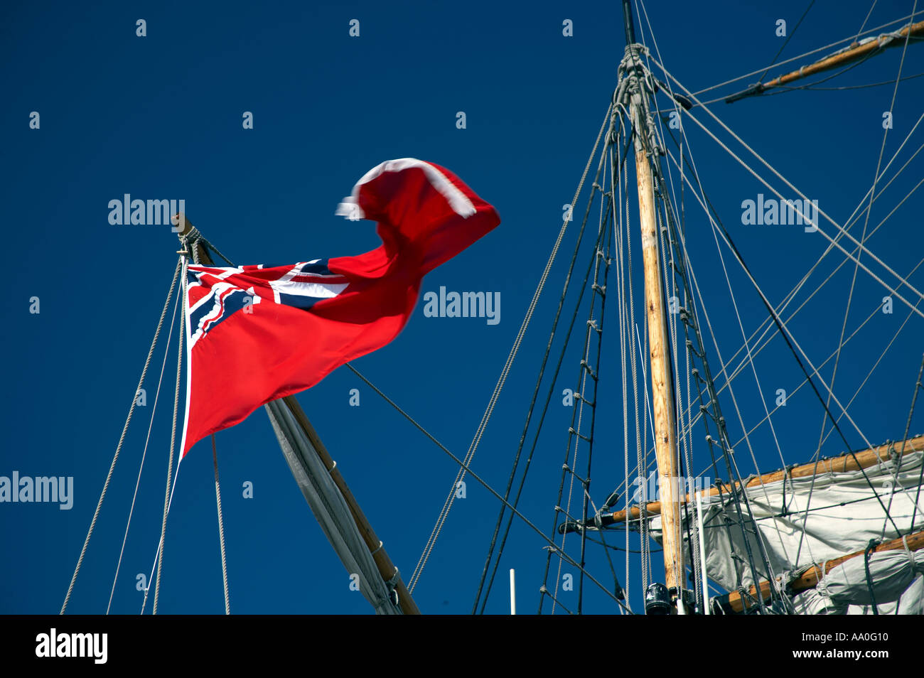 The Red Ensign fluttering on the Grand Turk replica sailing ship Whitby