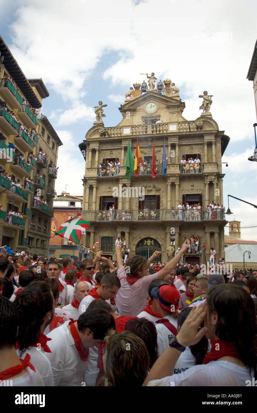 At noon on the sixth of July the chupinazo rocket explodes above Pamplona s baroque town hall heralding the start of Las Fies Stock Photo