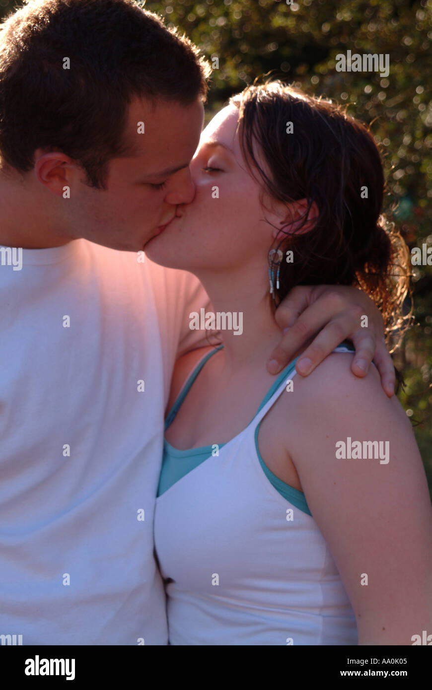 Spring couple walking kissing hi-res stock photography and images - Alamy