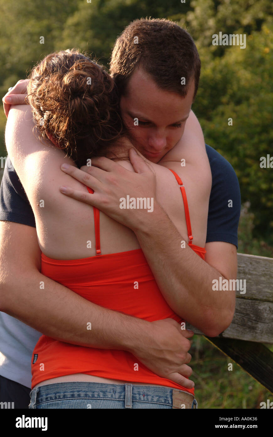 Romantic young couple cuddling hi-res stock photography and images - Alamy