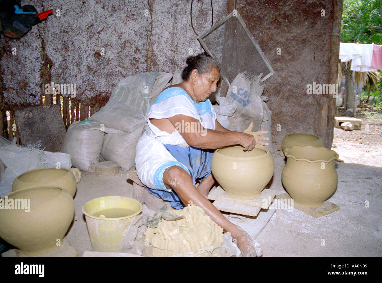 A woman making pottery Mexico Stock Photo