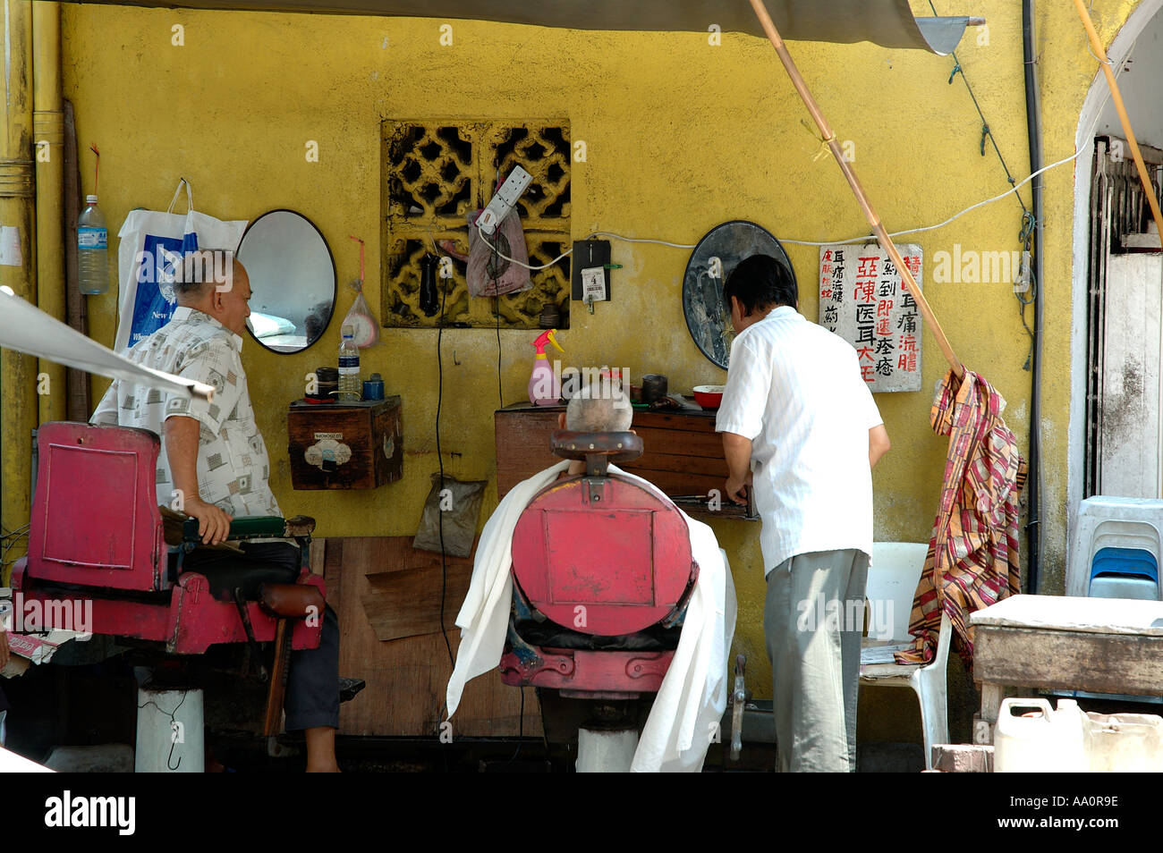 Open air barber shop in Petaling Street Malaysia Stock Photo Alamy