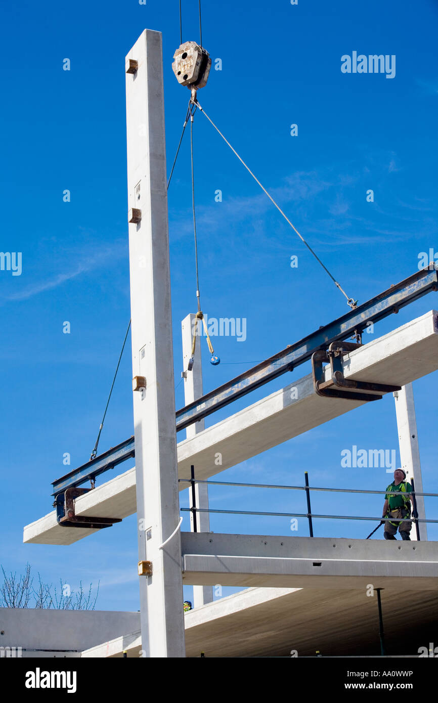 Construction worker working at height with edge protection wearing hard