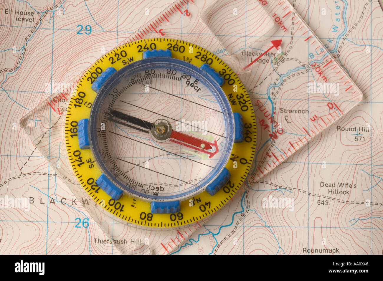 A compass taking a bearing on a map Stock Photo - Alamy