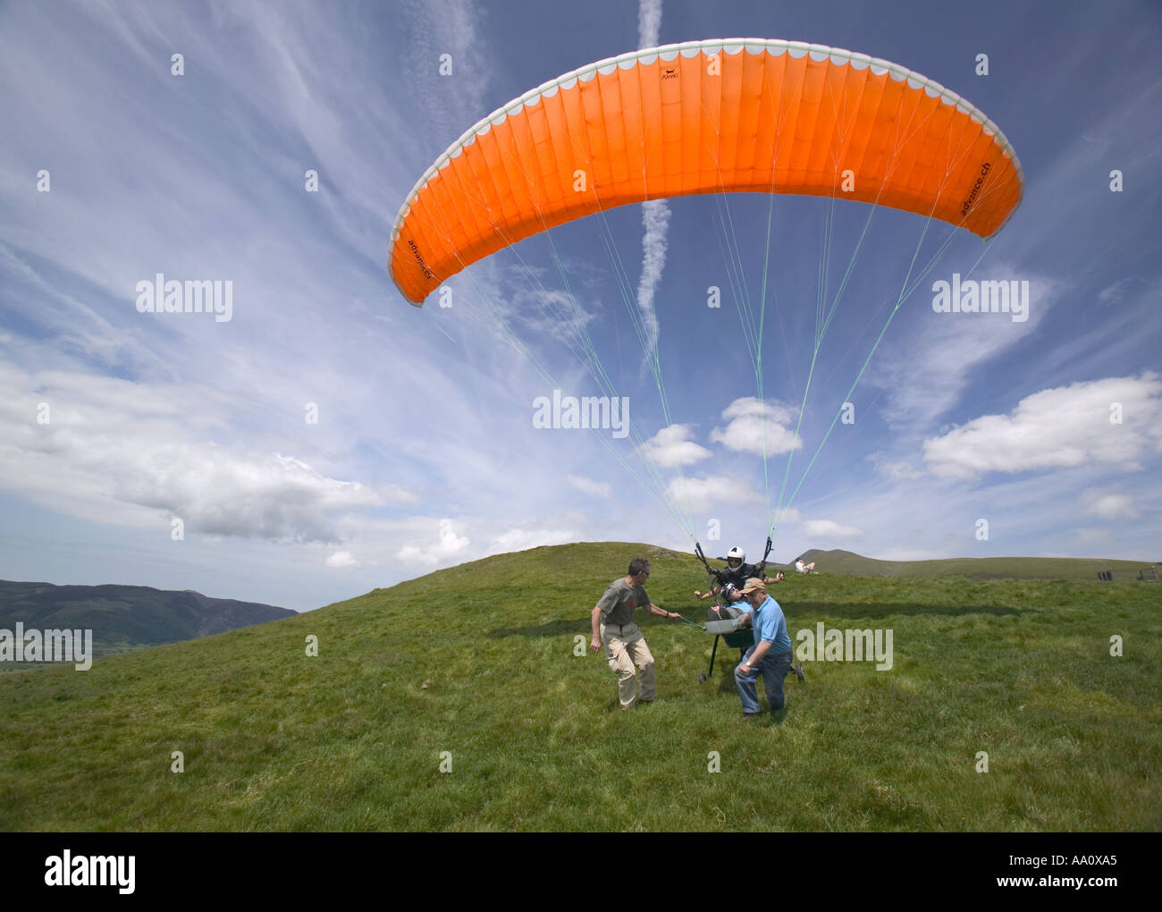 a wheelchair bound disabled person takes off in a parapont flight above