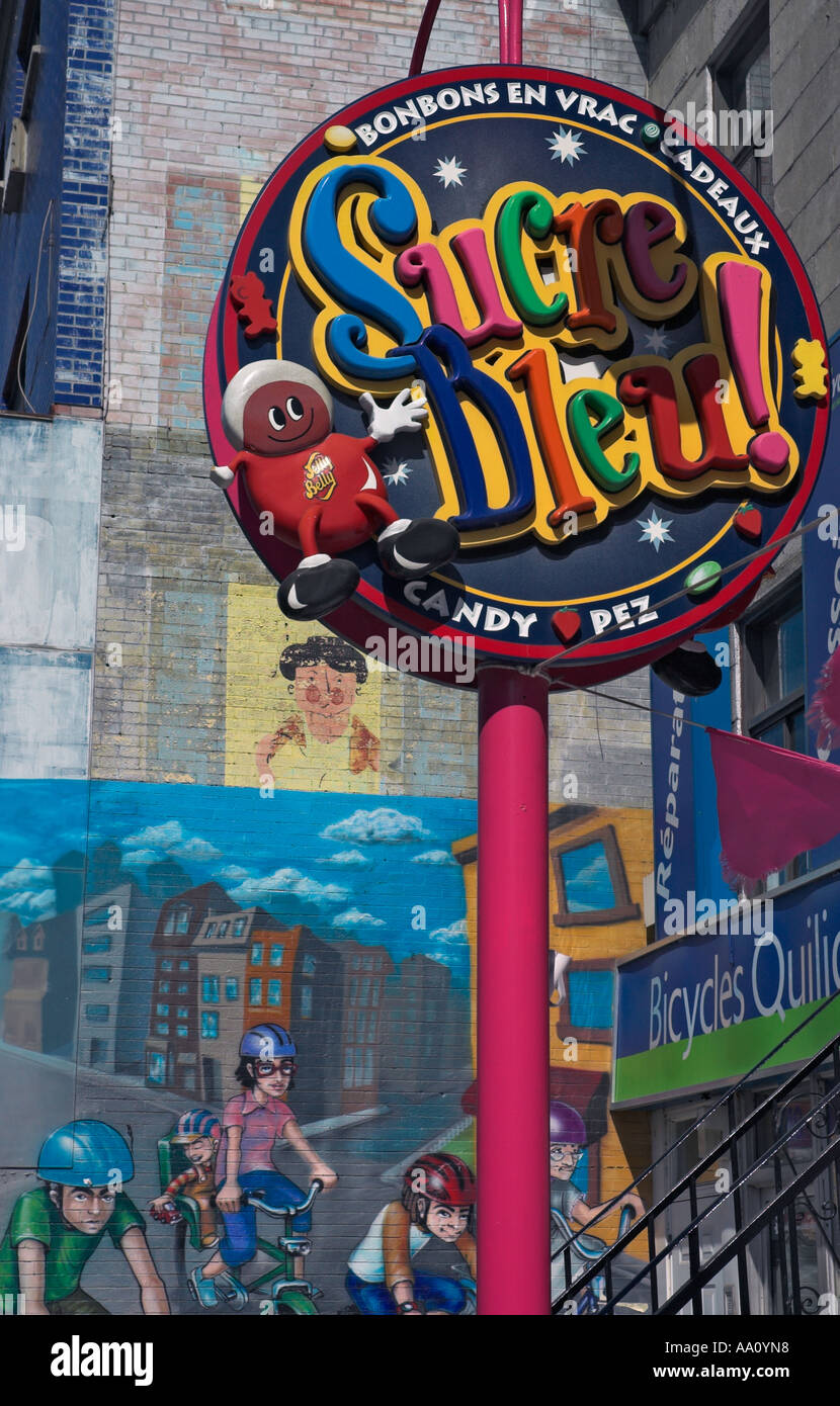 A Sign For A Sweet Shop Sucre Bleu With A Wall Mural Behind On Rue St Denis  In In The Plateau Area Of Montreal Stock Photo - Alamy