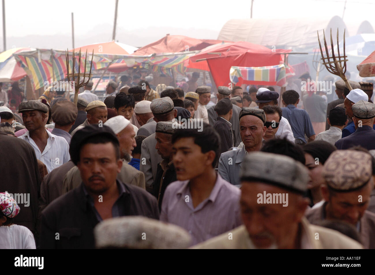 Crowds of people at the Sunday Market in Kashgar Xinjiang Province China Stock Photo