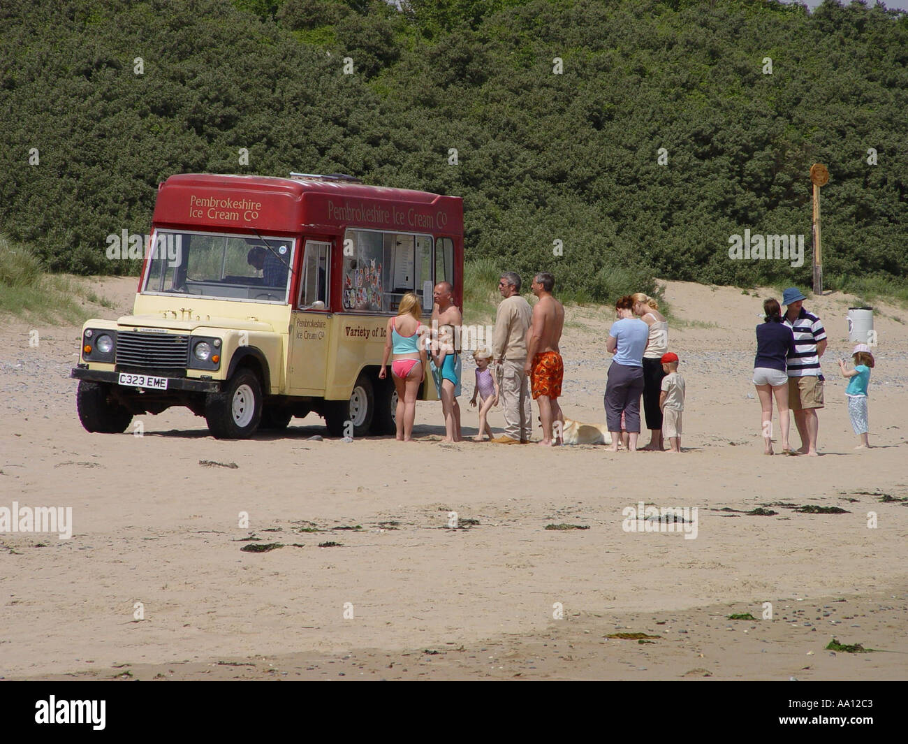 Vintage ice cream vendor parked on Tenby South Beach in the seaside town of Tenby Pembrokeshire Wales GB UK 2003 Stock Photo