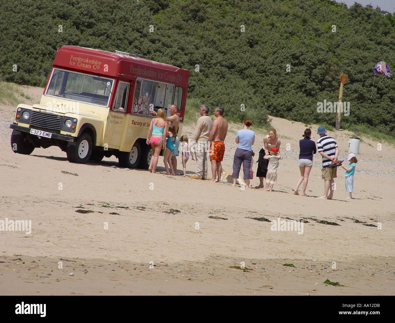 Vintage ice cream vendor parked on Tenby South Beach in the seaside town of Tenby Pembrokeshire Wales GB UK 2003 Stock Photo