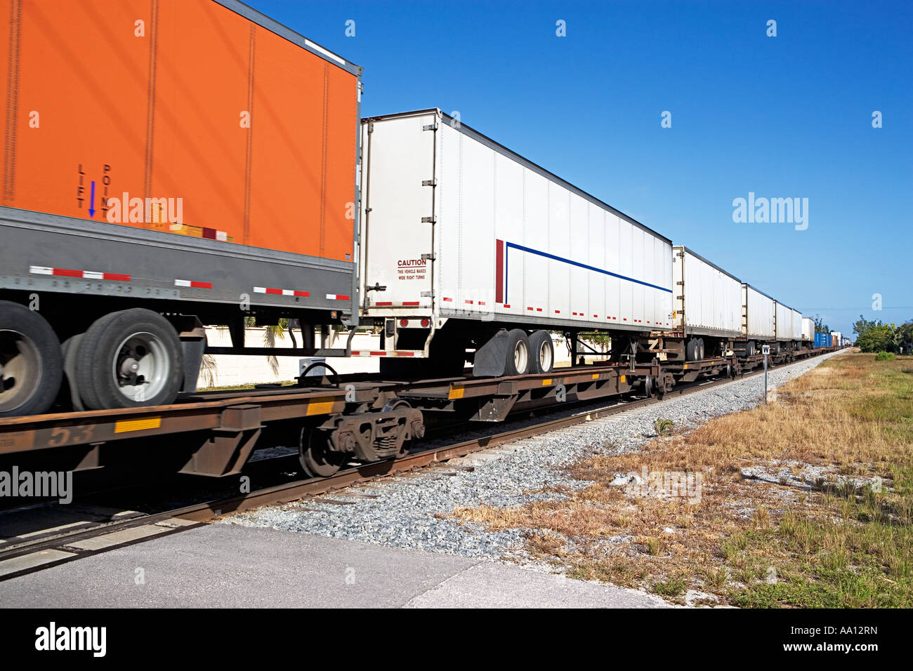 Truck trailers on a cargo container Stock Photo