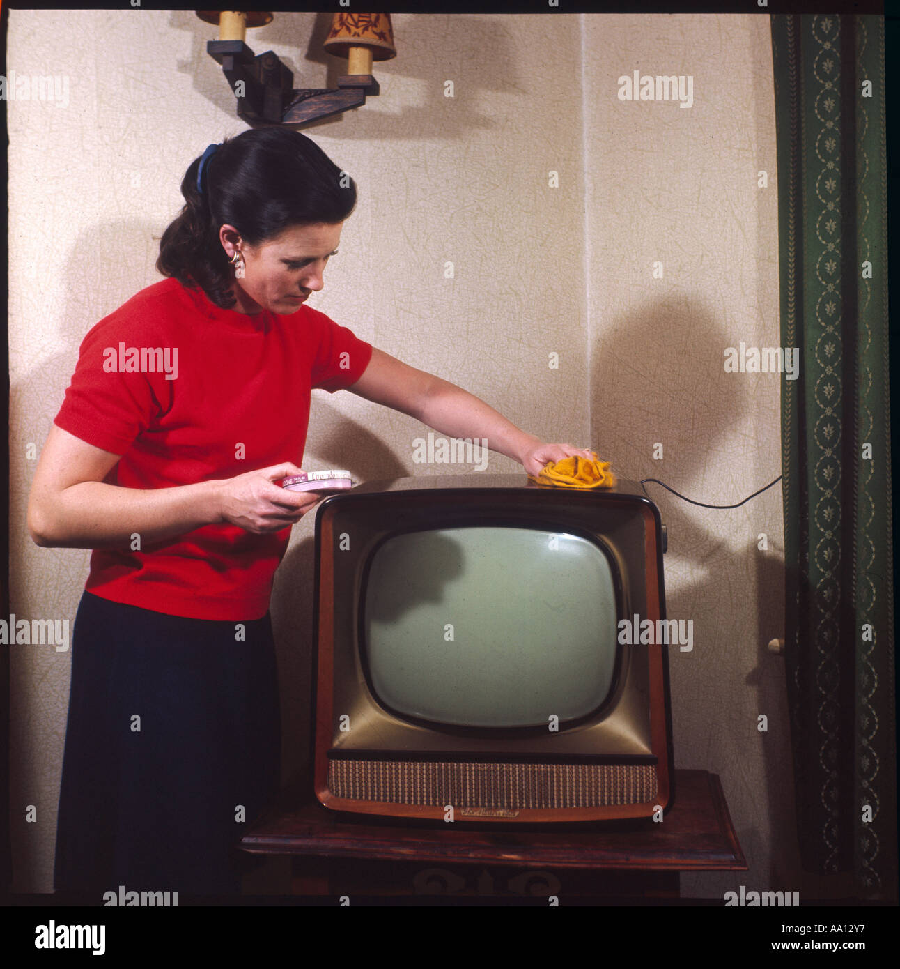 Dusting A Television Stock Photo