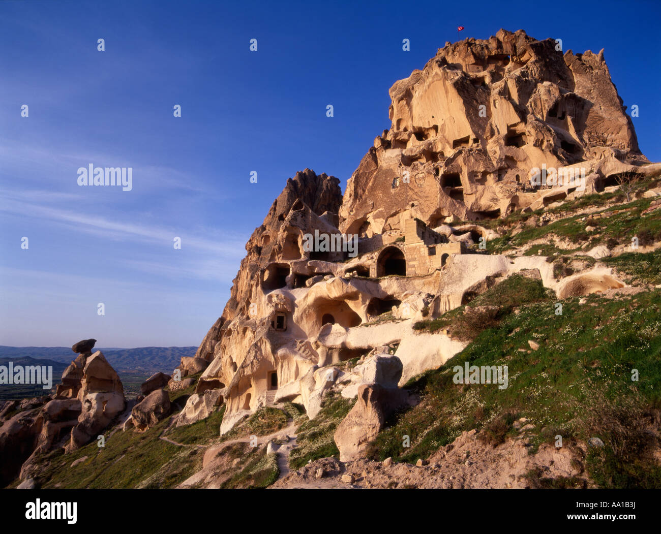 The honeycombed network of tunnels carved into the volcanic rock of the kale (fortress), Uchisar, Nevsehir, Cappadocia, Turkey Stock Photo