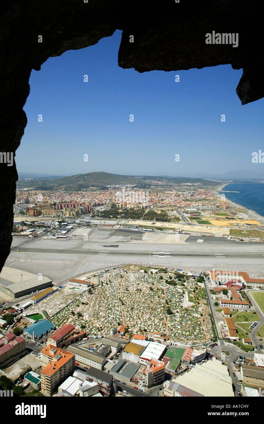 The view out of the old tunnels in the rock across the cemetery the airport and into Spain from