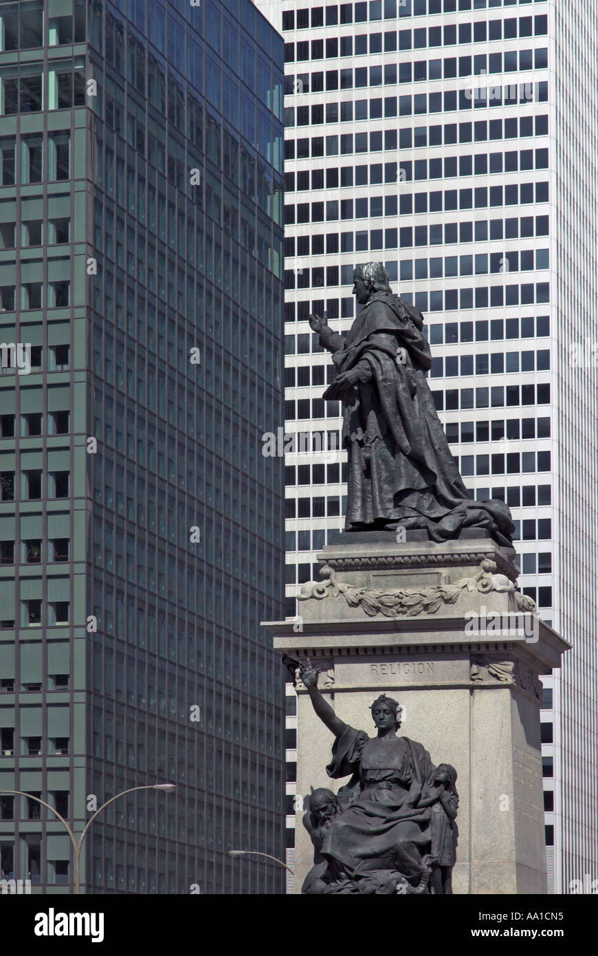 A statue in Montreal with the Ville Marie building behind Stock Photo