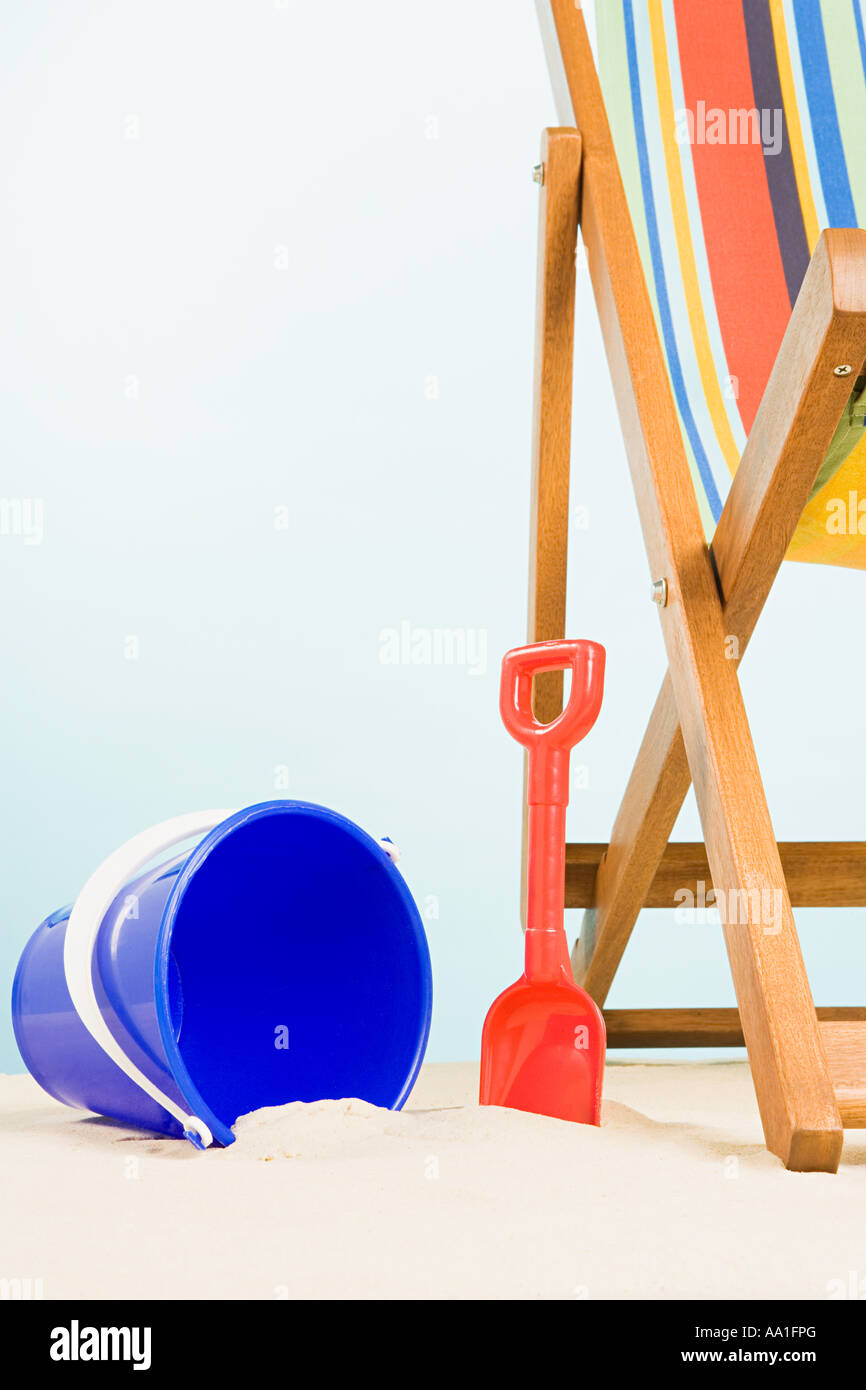Bucket and spade and deckchair Stock Photo Alamy