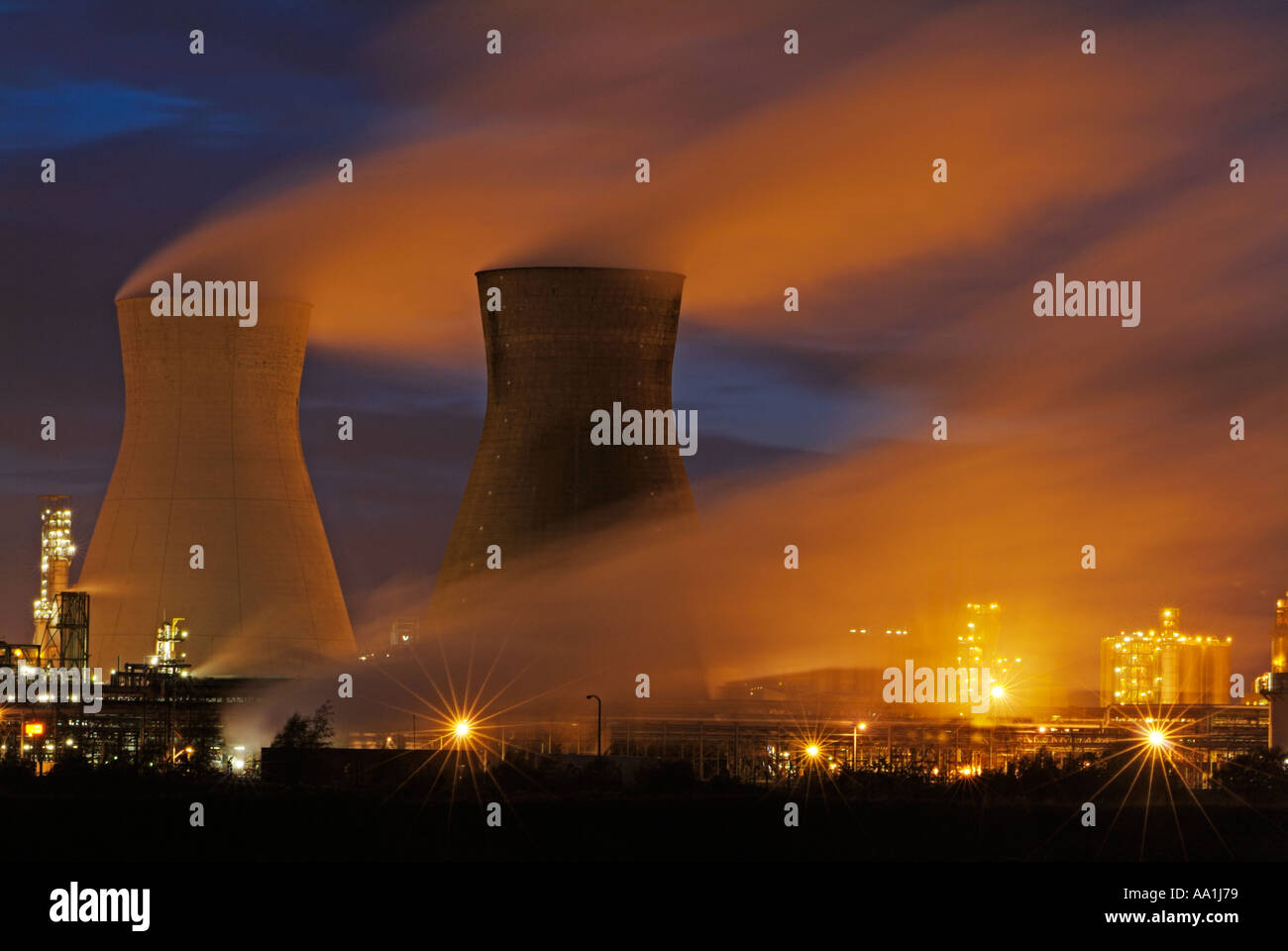 Two steaming cooling towers at night refinery at night Grangemouth Ineos petrochemical refinery Grangemouth Lothian Scotland UK GB Europe Stock Photo