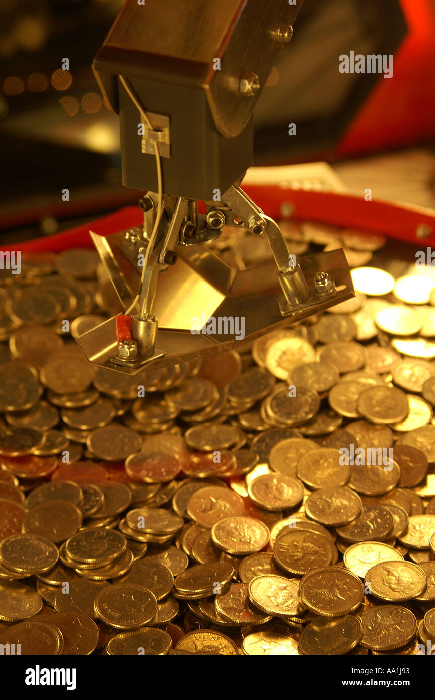 coins on gaming machine tray in palace pier Brighton and Hove Sussex