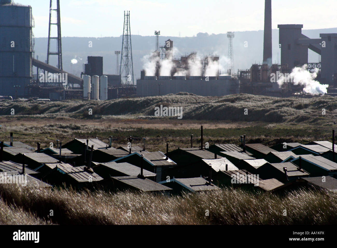 Green sheds and the Corus steel works at the river Tees Cleveland UK Stock Photo