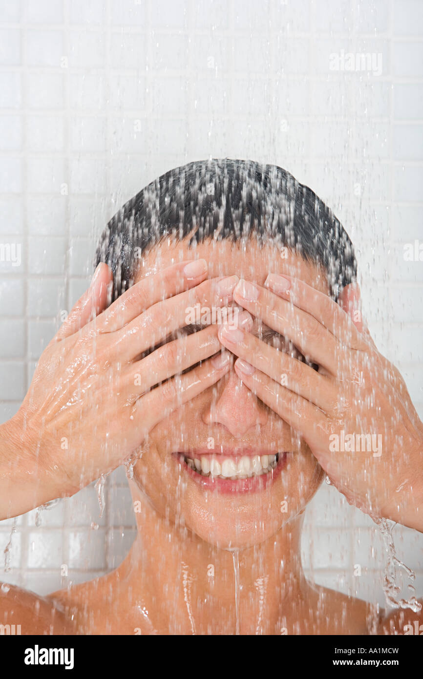 Woman showering Stock Photo - Alamy