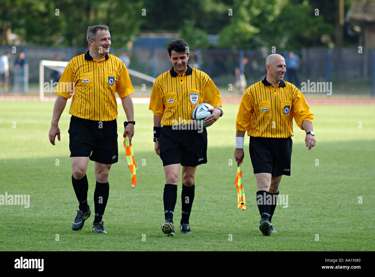 Football Referees Walking Off a Football Pitch at the End of a Game