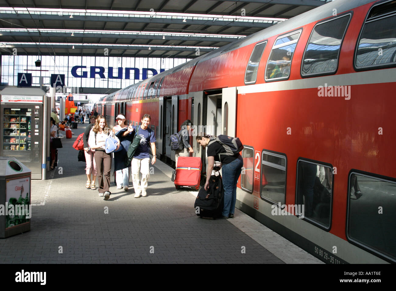 People are going over a platform at central station in Munich Bavaria Germany Stock Photo