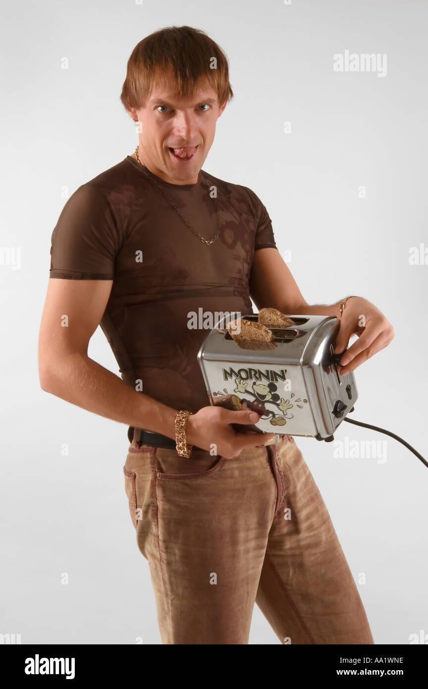 A man standing with toaster in his hands Stock Photo Alamy