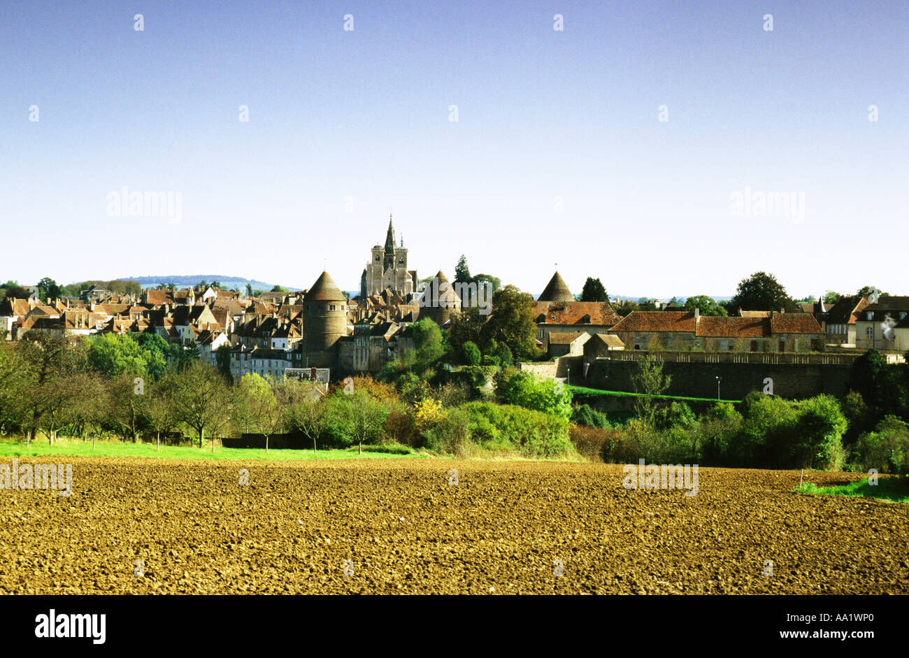 France, Burgundy, Auxerre, field, fortified medieval city in background Stock Photo