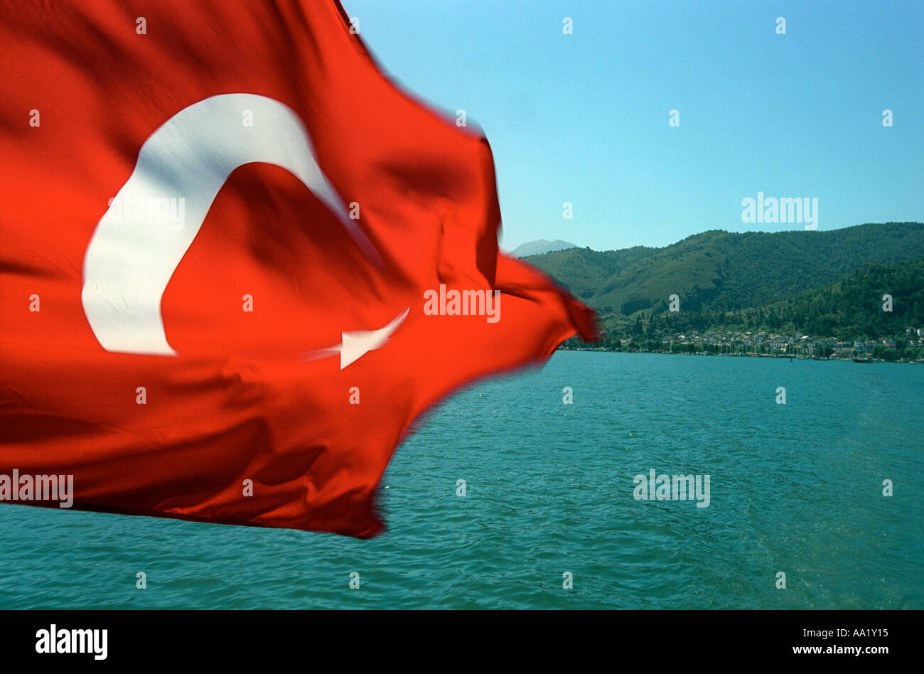 Flag of Turkey with Turkish coastline in the background Stock Photo